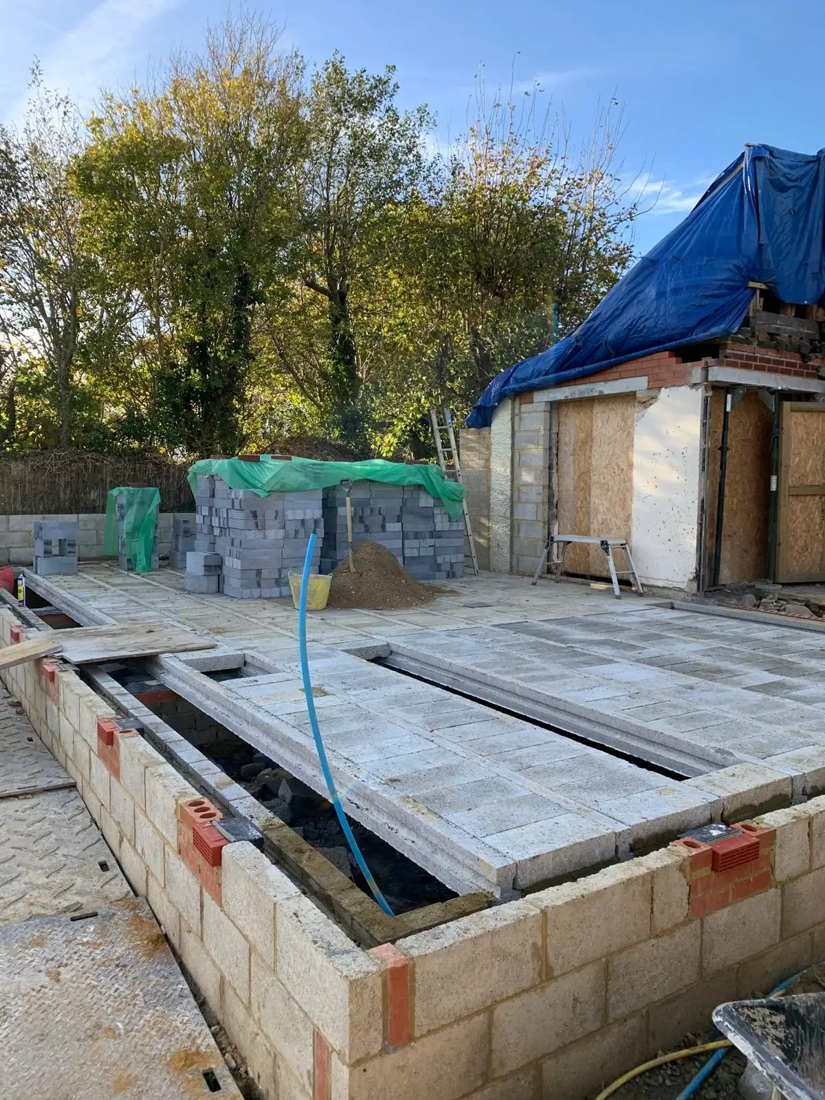 Completed home extension in Hastings showing perfect integration and a stable patio on quality groundworks.
