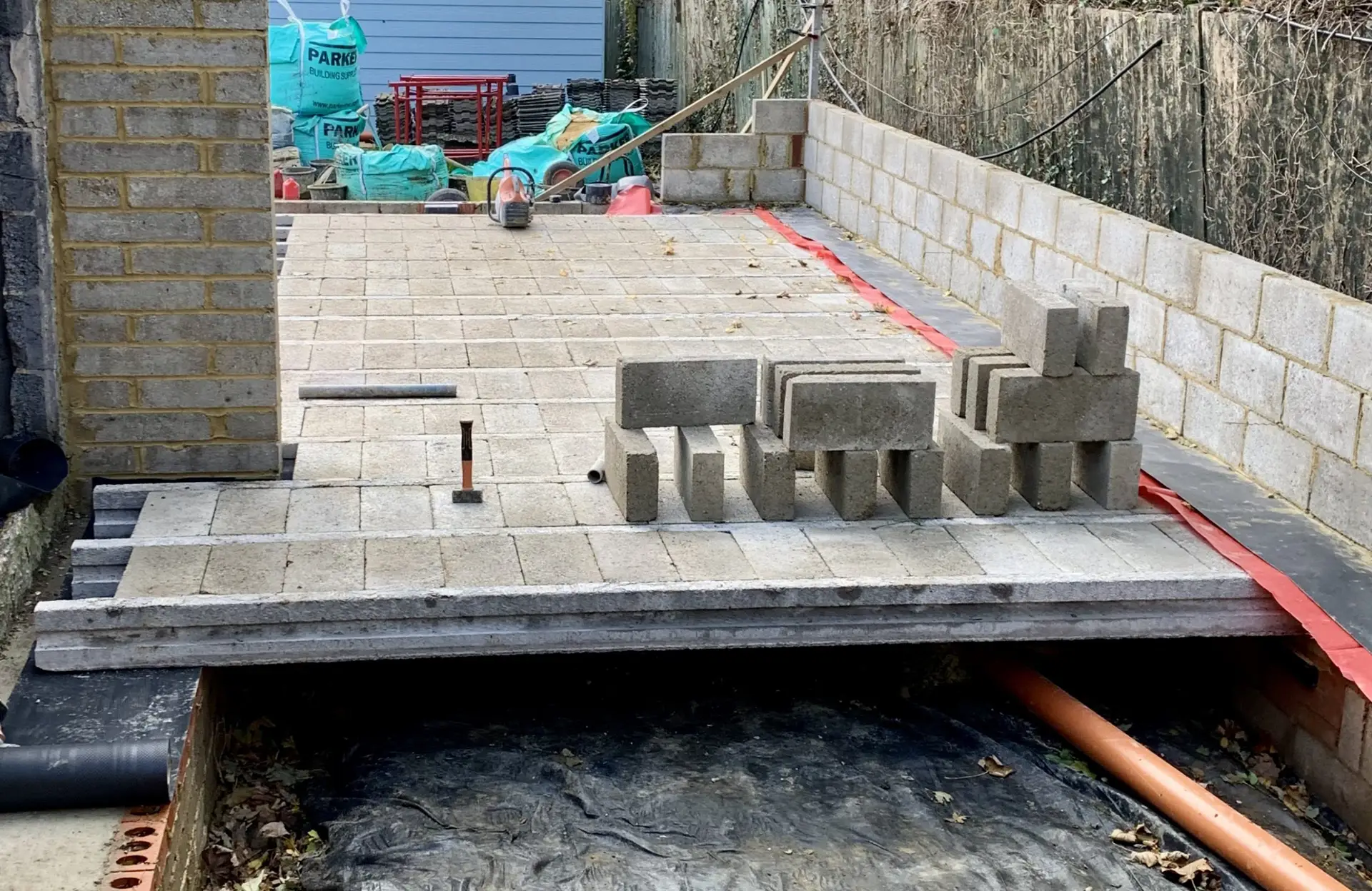 Building control inspector examining structural work and steel beam installation in Kent home